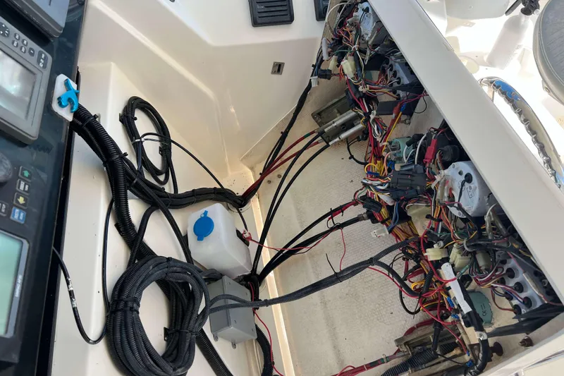 Slide: The Image of 2004 Henriques 35 Express boat wiring and control panel details. - 35