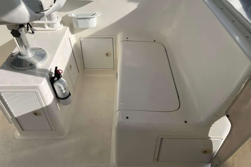 Slide: The Image of 2004 Henriques 35 Express boat interior with seating and storage compartments. - 37