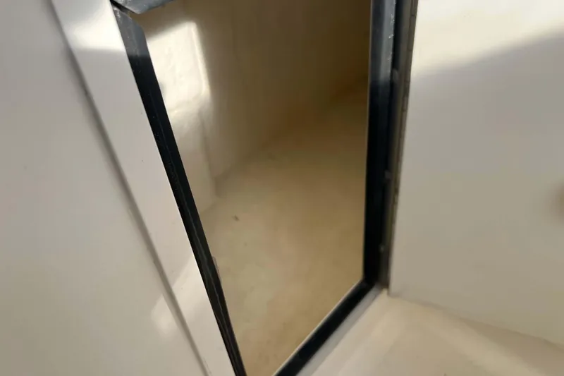 Slide: The Image of Open door on 2004 Henriques 35 Express boat, showing interior space. - 41