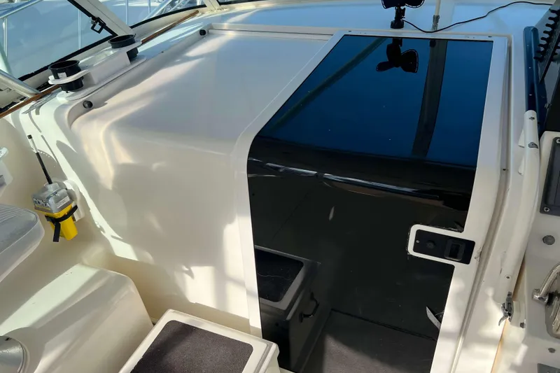 Slide: The Image of 2004 Henriques 35 Express boat interior with sleek design and modern controls. - 46