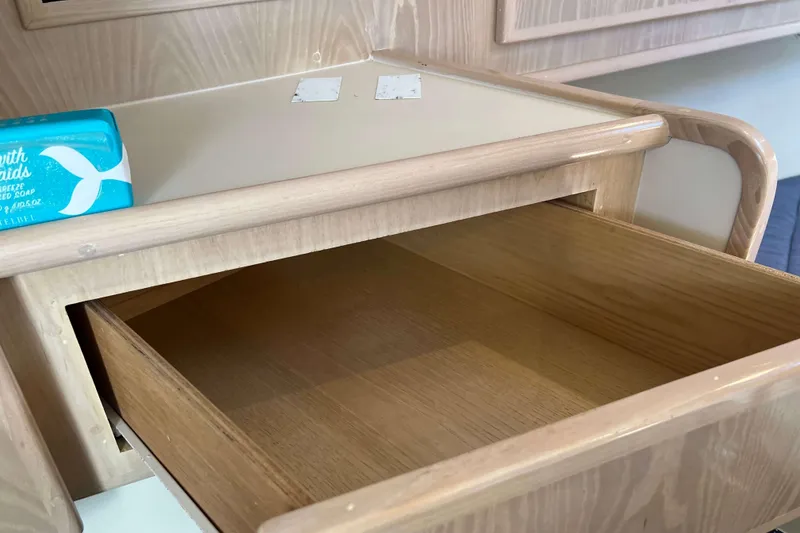 Slide: The Image of Open wooden drawer on 2004 Henriques 35 Express boat with soap on top. - 51