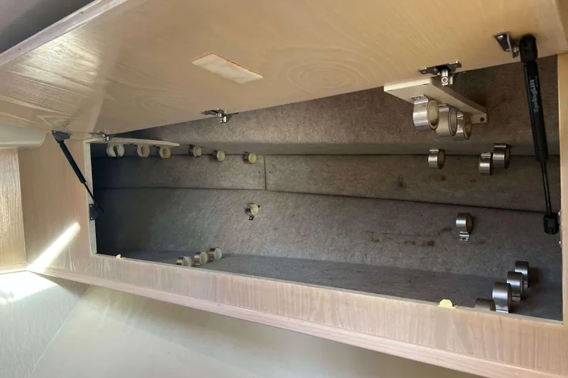 Slide: The Image of Interior storage compartment of a 2004 Henriques 35 Express boat. - 59