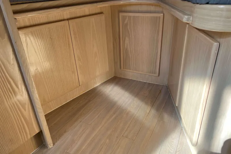 Slide: The Image of 2004 Henriques 35 Express interior with wooden cabinetry and flooring. - 63