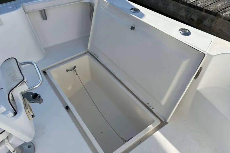 Slide: The Image of Open storage compartment on a 2004 Henriques 35 Express boat deck. - 7