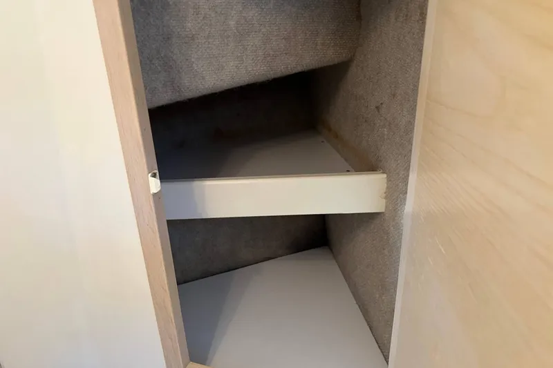 Slide: The Image of Interior storage compartment of a 2004 Henriques 35 Express boat. - 74