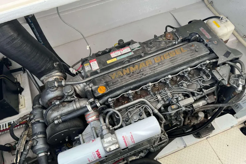 Slide: The Image of Yanmar diesel engine in a 2004 Henriques 35 Express boat. - 85