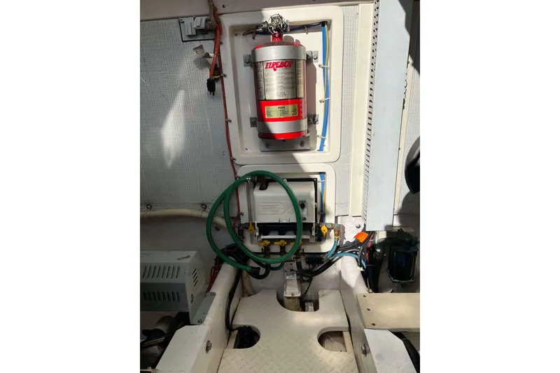 Slide: The Image of Engine compartment of a 2004 Henriques 35 Express boat with fire extinguisher system. - 87