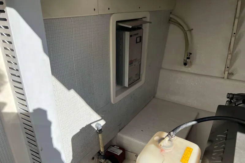 Slide: The Image of 2004 Henriques 35 Express interior with battery charger and wiring. - 88