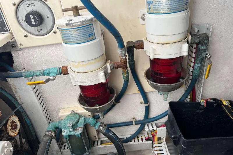 Slide: The Image of Engine room of 2004 Henriques 35 Express with fuel filter system and wiring. - 95