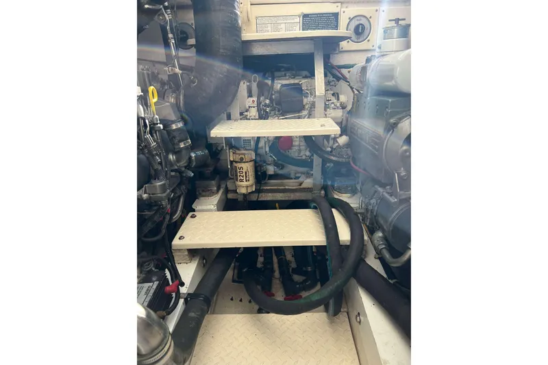 Slide: The Image of Engine room of 2004 Henriques 35 Express boat with visible machinery and components. - 97