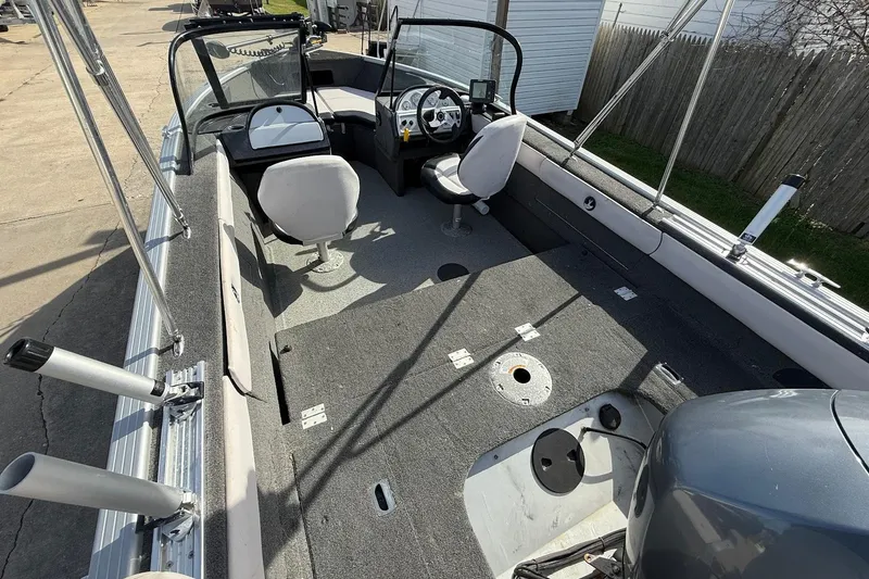 Slide: The Image of Steering console of a 2015 Starweld 1700 boat with gauges and a Humminbird fish finder. - 12