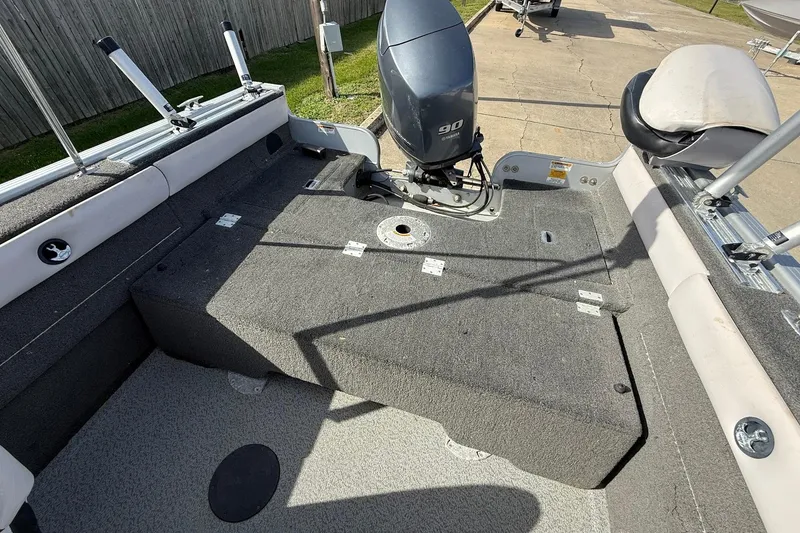 Slide: The Image of Interior of a 2015 Starweld 1700 boat, featuring seating and storage compartments. - 13