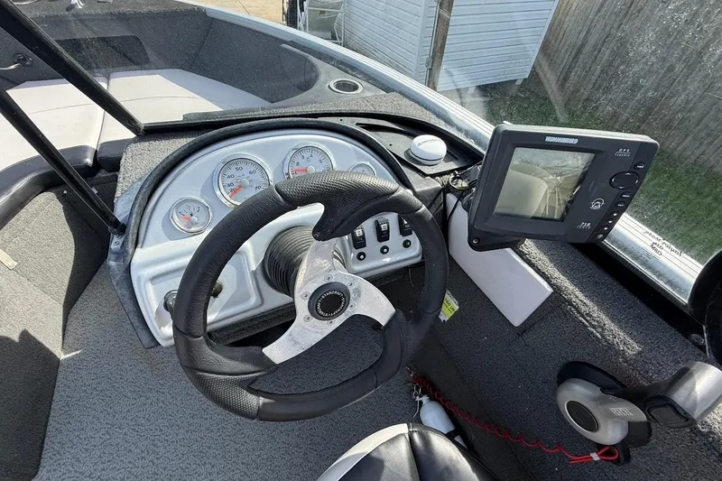 Slide: The Image of Minn Kota Power Drive V2 motor on a 2015 Starweld 1700 boat, outdoor setting. - 17