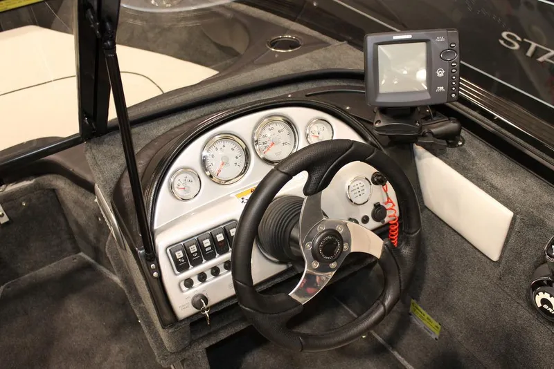 Slide: The Image of 2015 Starweld 1700 boat with Yamaha 90 engine on trailer, parked outdoors. - 3