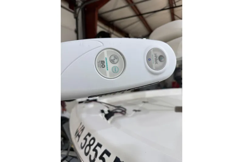 Slide: The Image of Close-up of a 2004 NauticStar 2200 NauticBay boat control panel in a garage. - 2