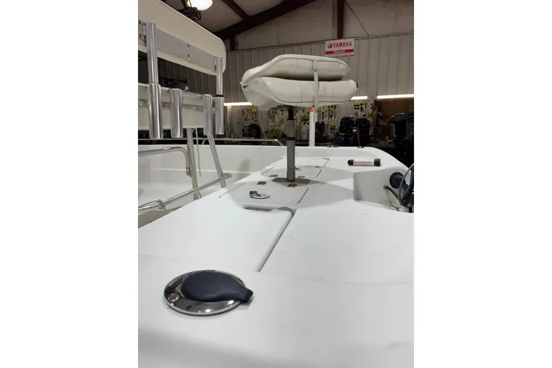 Slide: The Image of 2004 NauticStar 2200 NauticBay boat interior with seating and storage compartments. - 3