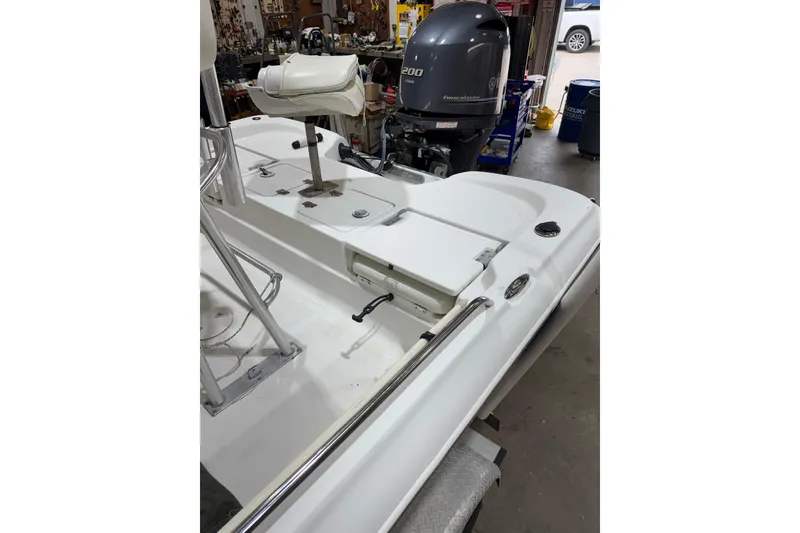 Slide: The Image of 2004 NauticStar 2200 NauticBay boat interior with Yamaha 200 engine in garage. - 7