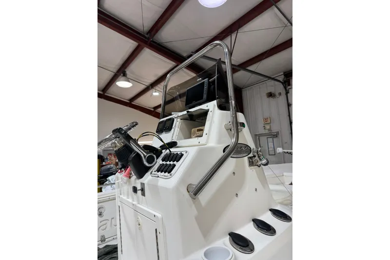 Slide: The Image of 2004 NauticStar 2200 NauticBay boat console in a warehouse setting. - 8