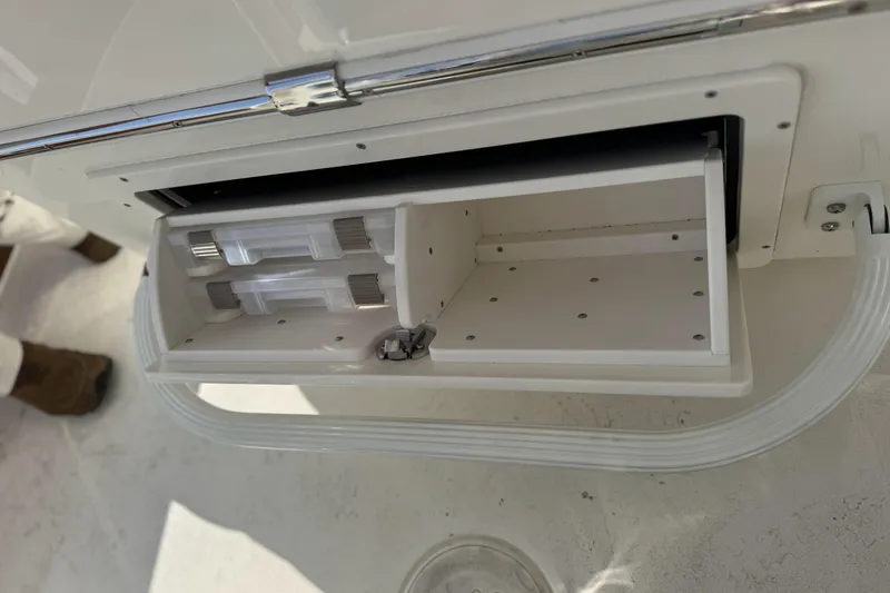 Slide: The Image of Open storage compartment in 2026 Pathfinder 2500 Hybrid boat. - 10