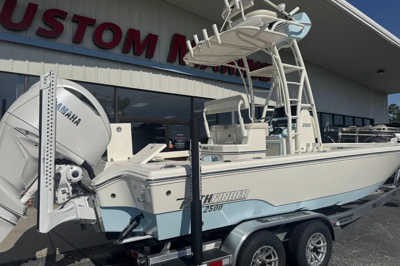 Slide: The Image of 2026 Pathfinder 2500 Hybrid boat with Yamaha engine at dealership. - 2