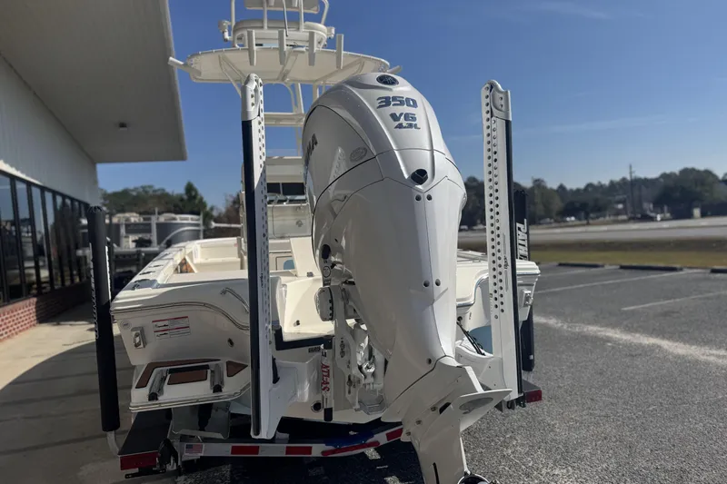 Slide: The Image of 2026 Pathfinder 2500 Hybrid boat with powerful 350 V6 engine, parked outdoors. - 3