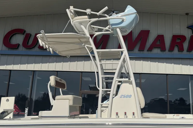 Slide: The Image of 2026 Pathfinder 2500 Hybrid boat with elevated seating, displayed at a marine dealership. - 5