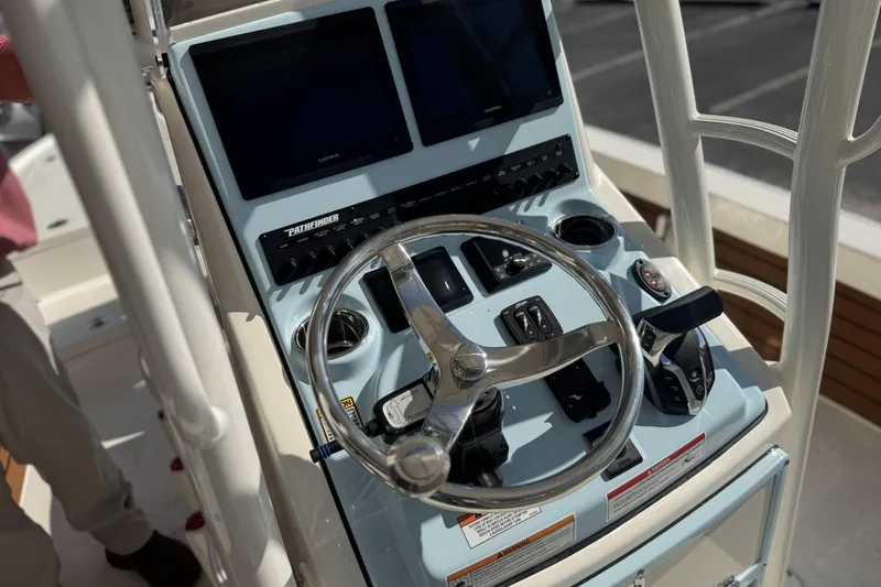 Slide: The Image of 2026 Pathfinder 2500 Hybrid boat console with steering wheel and controls. - 8