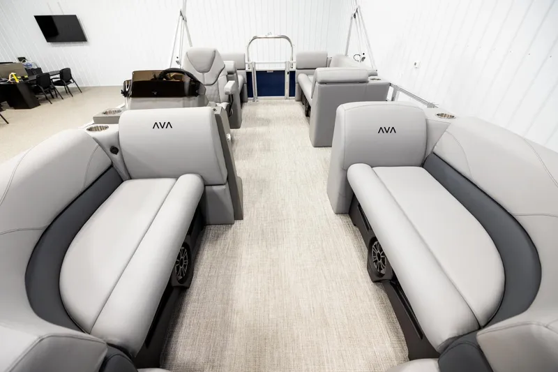 Slide: The Image of 2026 Avalon VLS QL boat interior with luxurious gray seating and modern dashboard. - 13