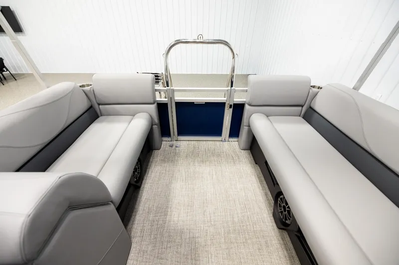 Slide: The Image of Interior of 2026 Avalon VLS QL pontoon boat with gray seating and steering console. - 15