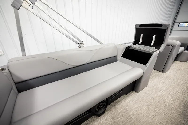 Slide: The Image of Luxurious seating in 2026 Avalon VLS QL boat, featuring sleek gray upholstery. - 21