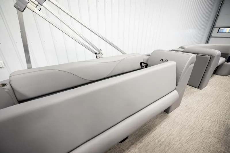 Slide: The Image of 2026 Avalon VLS QL boat interior with gray seating and storage compartment. - 22