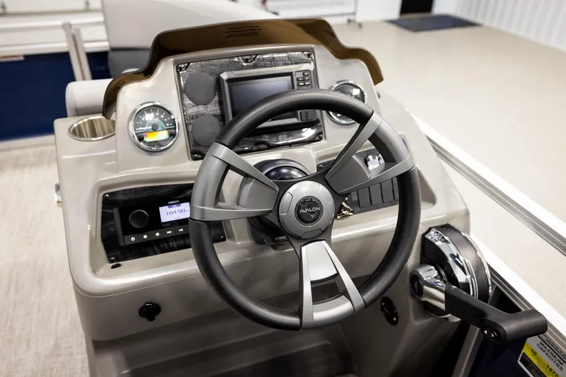 Slide: The Image of 2026 Avalon VLS QL boat dashboard with steering wheel and control panel. - 29