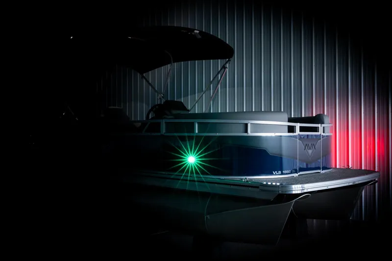 Slide: The Image of 2026 Avalon VLS QL pontoon boat with canopy in showroom, Reeder-Trausch Marine. - 4