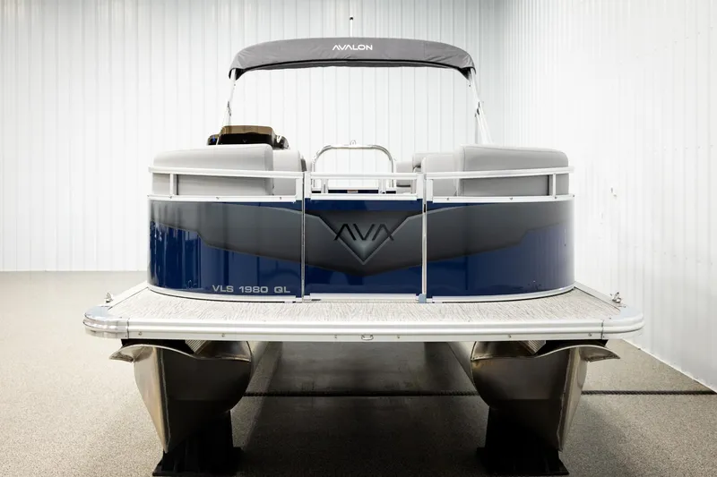 Slide: The Image of 2026 Avalon VLS QL pontoon boat in a showroom with canopy and modern design. - 8