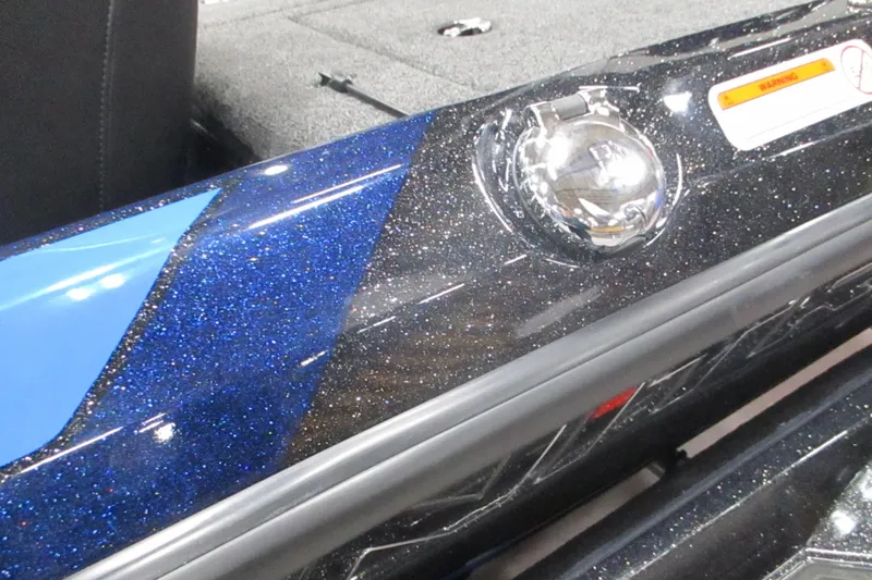 Slide: The Image of 2025 Nitro Z21 XL boat with sparkling blue and black finish, chrome fuel cap. - 11