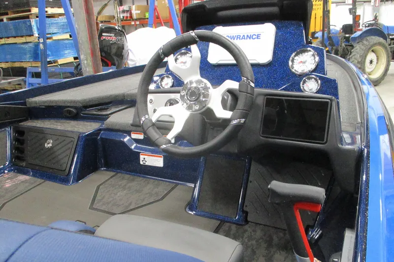 Slide: The Image of 2025 Nitro Z21 XL boat cockpit with steering wheel and dashboard controls. - 15