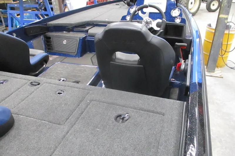 Slide: The Image of 2025 Nitro Z21 XL boat interior with steering wheel and seating. - 16