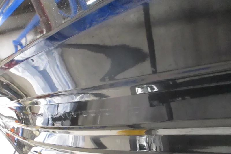 Slide: The Image of Close-up of 2025 Nitro Z21 XL boat hull with glossy black finish. - 2