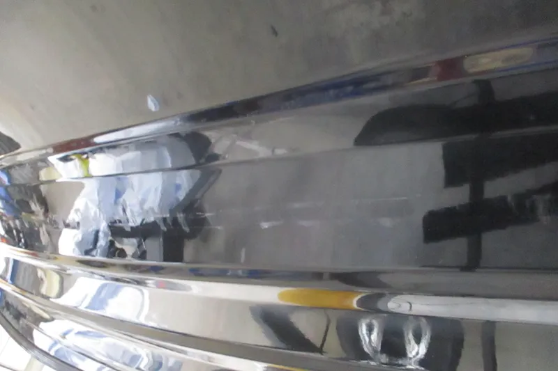 Slide: The Image of Close-up of 2025 Nitro Z21 XL boat hull with reflective surface. - 3