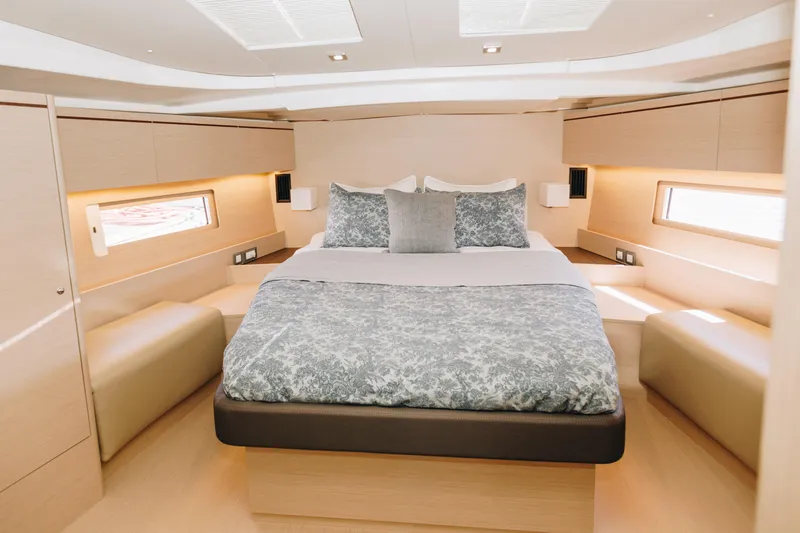 Slide: The Image of Luxurious cabin interior of 2024 Beneteau Oceanis 51.1 yacht with elegant bedding. - 9