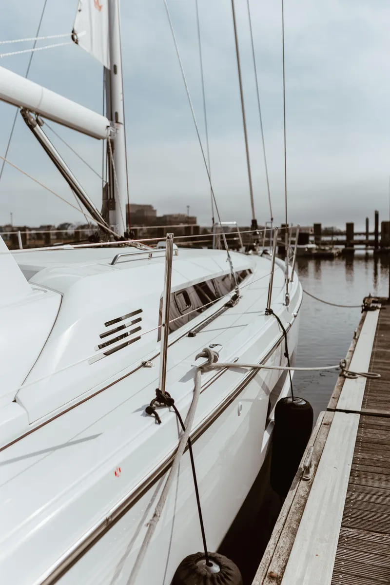 Slide: The Image of 2024 Beneteau Oceanis 46.1 yacht docked at marina, side view. - 3