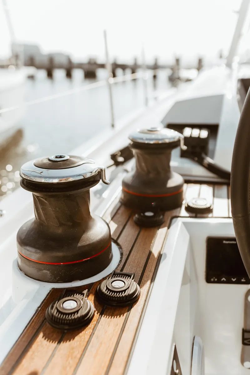 Slide: The Image of 2024 Beneteau Oceanis 46.1 yacht deck with winches and teak finish. - 7