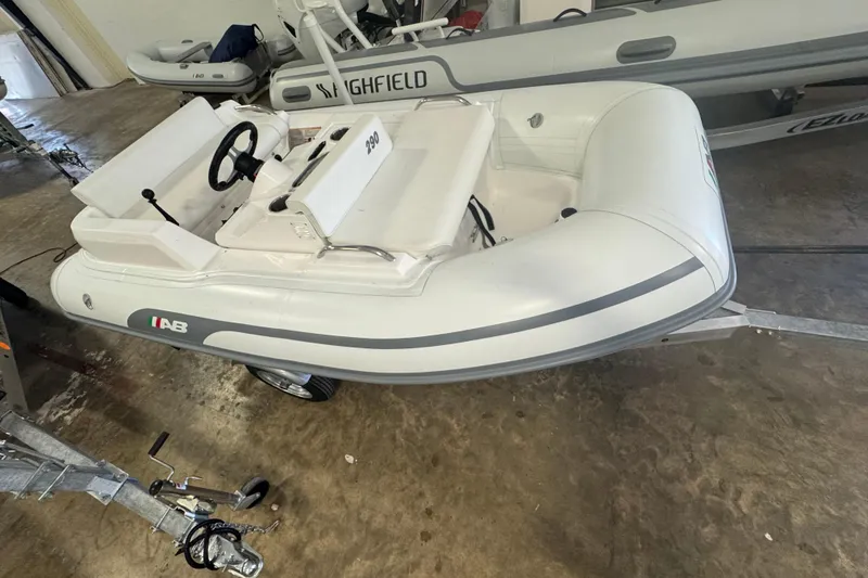 The Image of 2024 AB Inflatables ABJET 290 inflatable boat on trailer in a garage. - 0