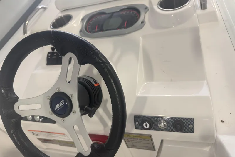Slide: The Image of 2024 AB Inflatables ABJET 290 dashboard with steering wheel and controls. - 3