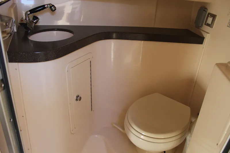 Slide: The Image of 2008 Grady-White Express 330 boat docked with twin Yamaha V8 engines. - 14