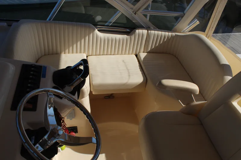 Slide: The Image of 2008 Grady-White Express 330 cabin interior with cozy bedding and decorative pillows. - 17