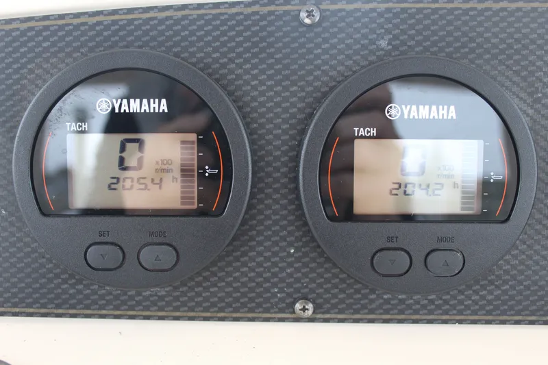 Slide: The Image of Compact kitchen area in a 2008 Grady-White Express 330 boat with sink and stove. - 21