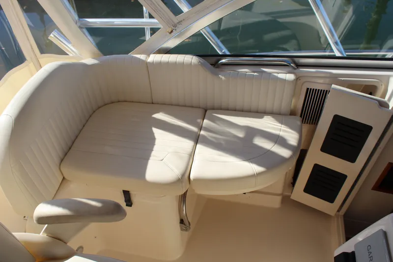 Slide: The Image of 2008 Grady-White Express 330 cabin interior with brown cushioned seating. - 28