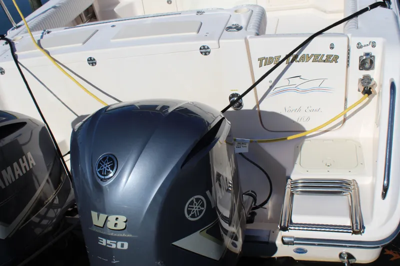 Slide: The Image of 2008 Grady-White Express 330 boat on calm water with scenic forest background. - 3