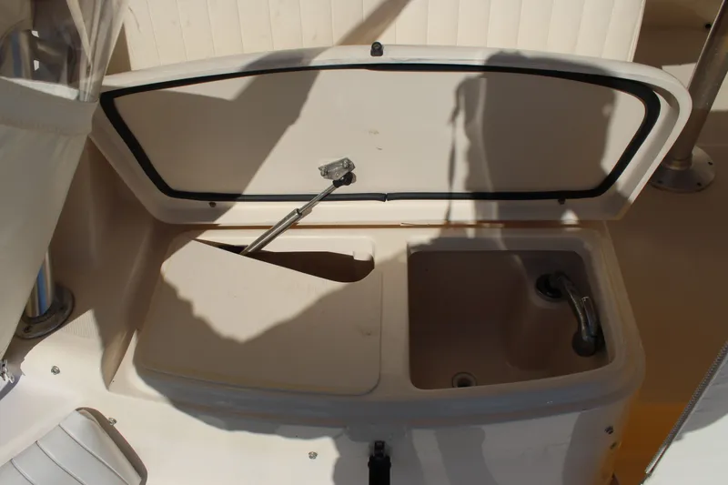Slide: The Image of 2008 Grady-White Express 330 helm with Garmin navigation and steering wheel. - 31